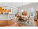 Dining room featuring hardwood floors and bright light, next to kitchen at 86 Wickham Ct., Pawleys Island, SC 29585