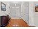 Bright foyer with hardwood floors, white trim, and a view of the front doors providing a grand entrance at 86 Wickham Ct., Pawleys Island, SC 29585