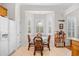Kitchen and eat-in dining area with wooden cabinets and bright natural light at 86 Wickham Ct., Pawleys Island, SC 29585