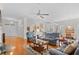 Bright living room with hardwood floors, comfortable seating, and an open layout connecting to the dining area at 86 Wickham Ct., Pawleys Island, SC 29585