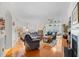 Spacious living room featuring hardwood floors, a fireplace, and ample seating for a comfortable gathering space at 86 Wickham Ct., Pawleys Island, SC 29585