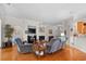 Inviting living room featuring a fireplace, hardwood floors, and an open layout ideal for modern living at 86 Wickham Ct., Pawleys Island, SC 29585
