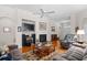 Comfortable living room with a fireplace, large TV, and plush seating perfect for relaxing and entertaining at 86 Wickham Ct., Pawleys Island, SC 29585