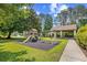 Community playground featuring a slide, swings, and picnic area offers fun outdoor recreation at 86 Wickham Ct., Pawleys Island, SC 29585
