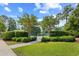 View of a neighborhood tennis court surrounded by lush greenery at 86 Wickham Ct., Pawleys Island, SC 29585