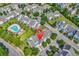 Aerial view of a neighborhood highlighting beautiful landscaping, homes, and a sparkling community pool at 101 Culpepper Way # 1006, Myrtle Beach, SC 29579