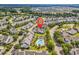 Aerial view showing the home's location in a neighborhood with mature landscaping and a community pool at 101 Culpepper Way # 1006, Myrtle Beach, SC 29579