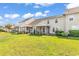 Spacious backyard featuring well-maintained lawns, screened porches, and charming landscaping for outdoor enjoyment at 101 Culpepper Way # 1006, Myrtle Beach, SC 29579