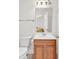 Bright bathroom showcasing a vanity with storage, toilet, mirror, and modern lighting fixtures at 101 Culpepper Way # 1006, Myrtle Beach, SC 29579