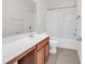 Bathroom with cherry cabinets, combination shower and tub at 101 Culpepper Way # 1006, Myrtle Beach, SC 29579