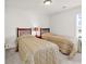 Bedroom featuring two twin beds, side table, and lamp at 101 Culpepper Way # 1006, Myrtle Beach, SC 29579
