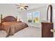 Spacious bedroom with natural light, ceiling fan, and classic furnishings at 101 Culpepper Way # 1006, Myrtle Beach, SC 29579