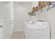 Functional laundry room with shelving, washer, and dryer, offering practical storage solutions at 101 Culpepper Way # 1006, Myrtle Beach, SC 29579