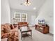 Cozy living room featuring neutral carpet, classic furniture, and ample natural light at 101 Culpepper Way # 1006, Myrtle Beach, SC 29579