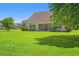 Spacious backyard featuring lush green grass and a screened-in porch perfect for outdoor living at 1025 Limpkin Dr., Conway, SC 29526