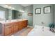 Bathroom featuring a soaking tub, dual sinks, and ample counter space at 1025 Limpkin Dr., Conway, SC 29526