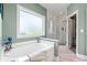Spa-like bathroom featuring a soaking tub, walk-in shower, and stylish design at 1025 Limpkin Dr., Conway, SC 29526