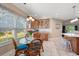 Cozy breakfast nook with sunlit window, a glass table, and views of the landscaped yard at 1025 Limpkin Dr., Conway, SC 29526