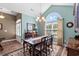 Inviting dining room featuring a large arched window and elegant chandelier at 1025 Limpkin Dr., Conway, SC 29526