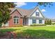 Charming home with a combination of brick and siding exterior, complemented by lush landscaping at 1025 Limpkin Dr., Conway, SC 29526