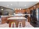 Modern kitchen with island, pendant lighting, stainless steel appliances, and ample cabinet space at 1025 Limpkin Dr., Conway, SC 29526