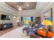Spacious living room with modern furnishings and a view to the landscaped backyard at 1025 Limpkin Dr., Conway, SC 29526