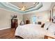 Relaxing main bedroom showcasing a tray ceiling and a large, comfortable bed at 1025 Limpkin Dr., Conway, SC 29526