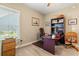 Office space with a desk, chair, and shelving unit, complemented by natural light from the window at 1025 Limpkin Dr., Conway, SC 29526
