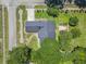 Aerial top-down view of the property showcasing the house, landscaping, and surrounding streets at 1043 South Main St., Aynor, SC 29511