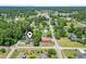 Aerial view showcases the home's location within a lush, tree-filled neighborhood at 1043 South Main St., Aynor, SC 29511