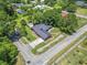 An aerial view showcasing the home's backyard, landscaping, and neighborhood at 1043 South Main St., Aynor, SC 29511
