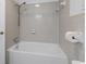 This bathroom features a tub and shower combination with gray tile and a silver showerhead at 1043 South Main St., Aynor, SC 29511
