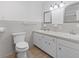 Bright bathroom features double sinks with framed mirrors and custom tile flooring at 1043 South Main St., Aynor, SC 29511