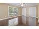 Large bedroom with shiny hardwood floors, two large windows and double closets at 1043 South Main St., Aynor, SC 29511