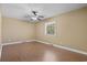 Simple bedroom with neutral walls, hardwood floors, and a ceiling fan at 1043 South Main St., Aynor, SC 29511