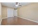 Bedroom featuring hardwood floors, neutral walls, and closet space at 1043 South Main St., Aynor, SC 29511