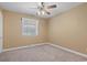 Neutral bedroom featuring a ceiling fan, neutral walls, and natural light at 1043 South Main St., Aynor, SC 29511