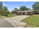 Lovely brick home featuring a convenient carport and a spacious driveway at 1043 South Main St., Aynor, SC 29511