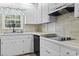 Traditional kitchen featuring bright, white cabinets, and modern appliances at 1043 South Main St., Aynor, SC 29511