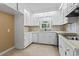 Efficient kitchen with white cabinetry, functional appliances and plenty of counter space at 1043 South Main St., Aynor, SC 29511