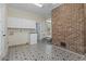 Well-appointed laundry room, features built-in cabinets and a utility sink for added convenience at 1043 South Main St., Aynor, SC 29511
