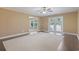 Spacious living room featuring neutral walls, hardwood-style flooring, and access to outdoor space at 1043 South Main St., Aynor, SC 29511