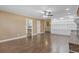 Open-concept living room showcasing a brick fireplace, built-in cabinets and seamless transition to other areas at 1043 South Main St., Aynor, SC 29511