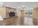 Spacious living room features a brick fireplace and ample natural light from a large window at 1043 South Main St., Aynor, SC 29511