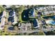 Aerial view of townhouses with pond, fountain, and lush landscaping; shows community layout and serene environment at 107 Pawleys Place Dr. # 107, Pawleys Island, SC 29585