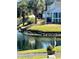 Backyard featuring a pond with lush landscaping, providing a tranquil and picturesque outdoor space at 107 Pawleys Place Dr. # 107, Pawleys Island, SC 29585