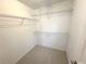 Walk-in closet with carpet and wire shelving at 107 Pawleys Place Dr. # 107, Pawleys Island, SC 29585