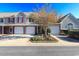 Charming townhouse featuring a one-car garage, manicured landscaping, and neutral siding, radiating curb appeal at 107 Pawleys Place Dr. # 107, Pawleys Island, SC 29585