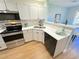 Bright kitchen featuring stainless steel appliances, new countertops, and plenty of cabinet space at 107 Pawleys Place Dr. # 107, Pawleys Island, SC 29585