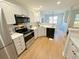 Updated kitchen with stainless appliances, a modern design, and lots of natural light at 107 Pawleys Place Dr. # 107, Pawleys Island, SC 29585